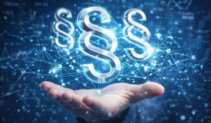 Hand som håller i lysande paragrafer mot en teknisk bakgrund